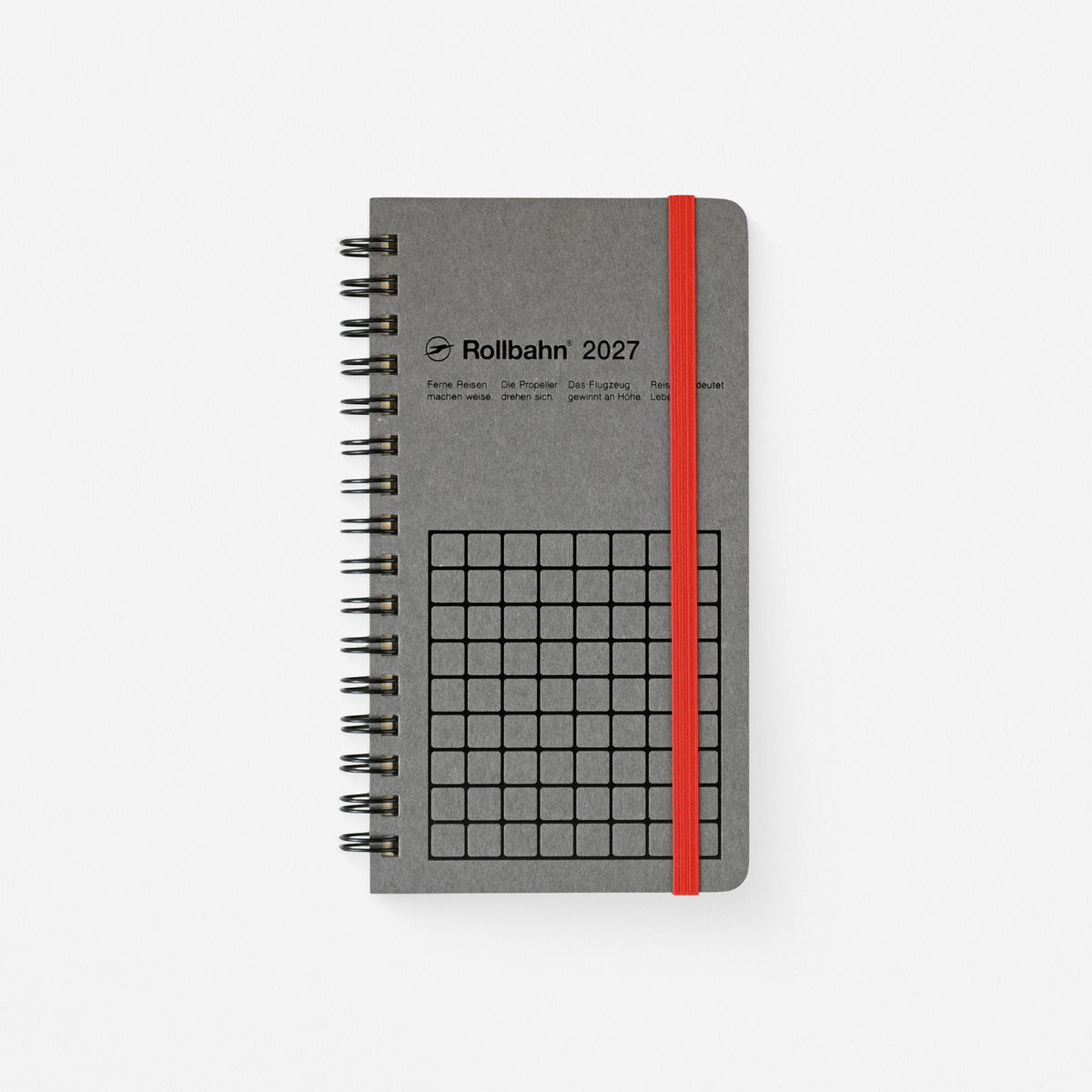 2027 Rollbahn Monaural Slim planner with black grid design on gray background, black spiral and orange elastic band
