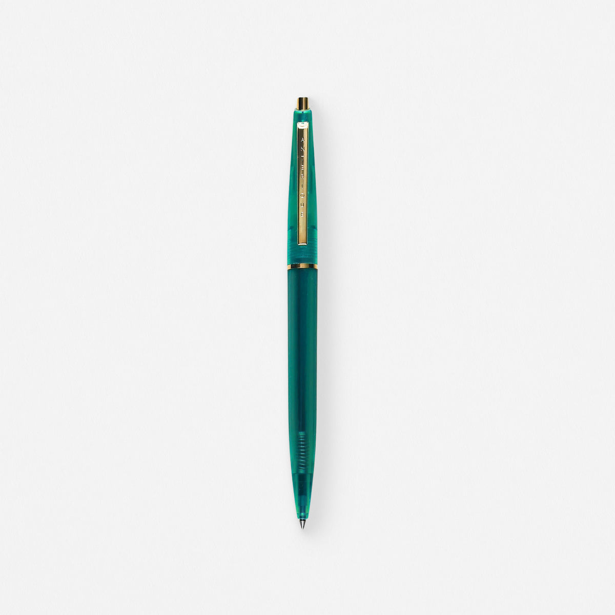 Anterique Ballpoint Pen in clear green, translucent barrel with brass accents