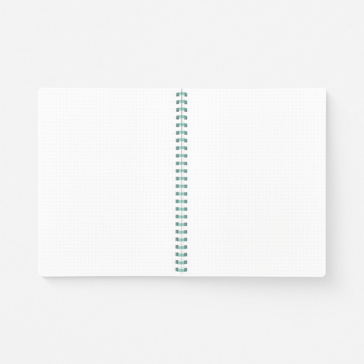 Kokuyo Sooofa Soft Ring Notebook, open to show warm-gray 4mm grid pages and flexible D-shaped ring